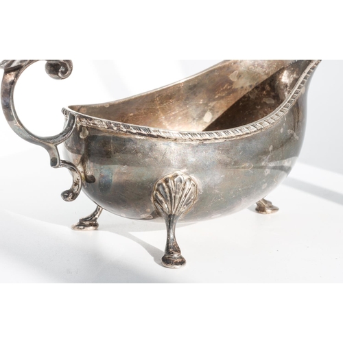 224 - Silver Sauceboat with Gadrooned Rim Decoration and Leaf Capped Flying Scroll Handle