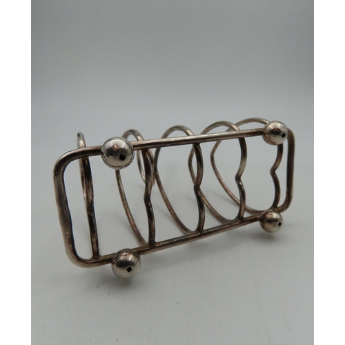 277 - Antique Silver Toast Rack Shaped Form on Bun Supports with Ring Carry Handle