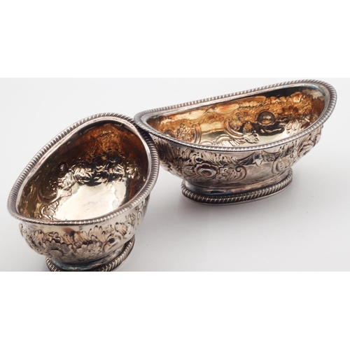 384 - Pair of Georgian Silver Embossed Decorated Boat Form Salts