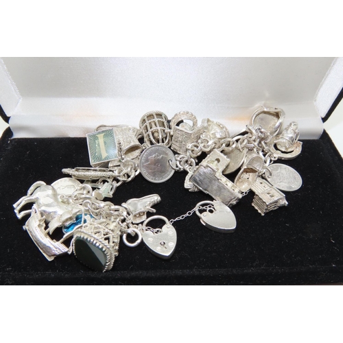 530 - Silver Charm Bracelet Laden with Numerous Charms Finely Detailed Good Weight