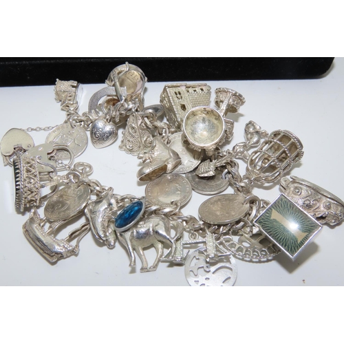 530 - Silver Charm Bracelet Laden with Numerous Charms Finely Detailed Good Weight