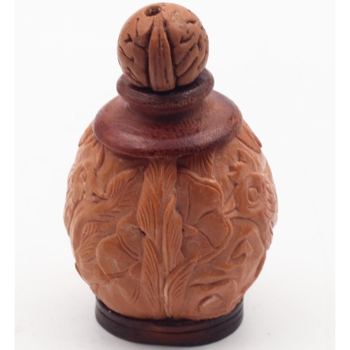 577 - Cola Nut Carved Snuff Bottle Eastern with Dipper