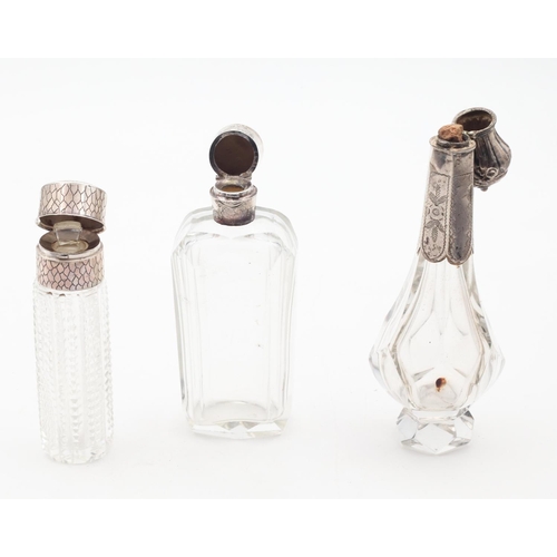 586 - Three Silver Top Crystal Scent Bottles