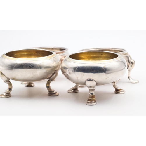 599 - Set of Four Georgian Silver Salts Circular Form Shaped Supports