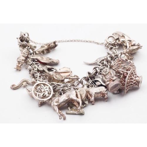 637 - Ladies Silver Charm Bracelet Laden with Numerous Charms