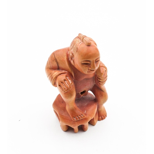 724 - Carved Figure of Squatting Man