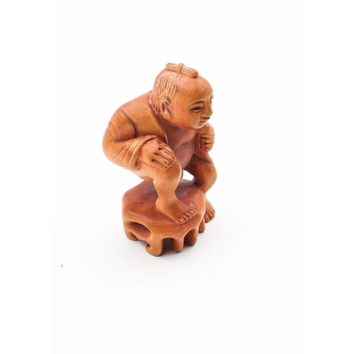 724 - Carved Figure of Squatting Man