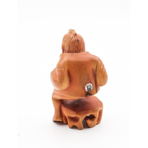 724 - Carved Figure of Squatting Man