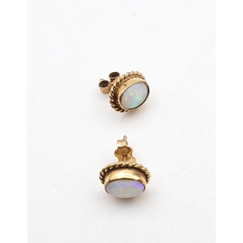 731 - Pair of 9 Carat Yellow Gold Mounted Opal Oval Cut Ladies Earrings