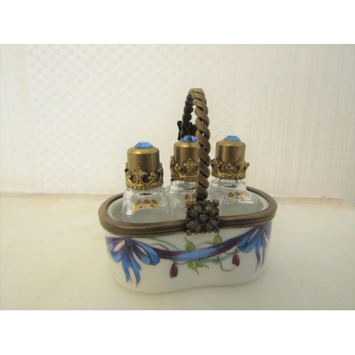 932 - Novelty Limoges Three Bottle Perfume Tantalus with Ormolu Mounts Gemset Tops to Crystal Bottles Attr... 