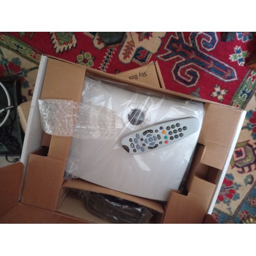 776 - Two Sky Boxes Still in Packaging with Remote Controls, etc. and Another Receiver