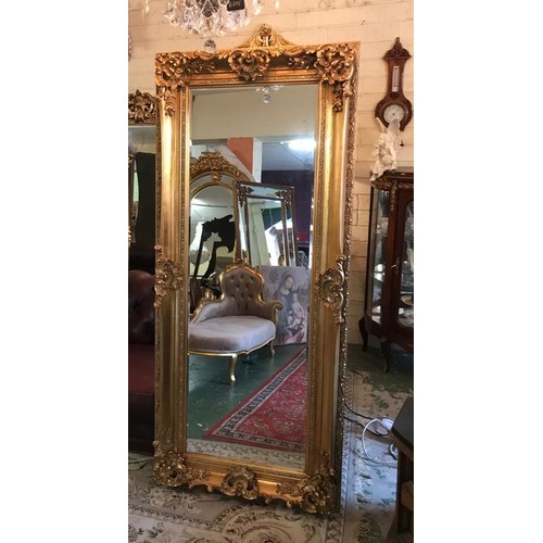 784 - Rectangular Form Gilded Wall Mirror with Swept Corner Detailing Approximately 6ft 4 Inches High x 2f... 