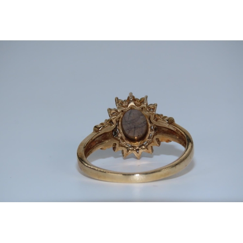 36 - Cabochon Cut Oval Centre Stone Ring with Diamond Surrounds Mounted on 9 Carat Yellow Gold Band Ring ... 
