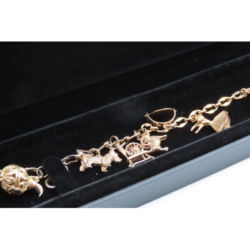 76 - 9 Carat Yellow Gold Ladies Charm Bracelet of Good Weight