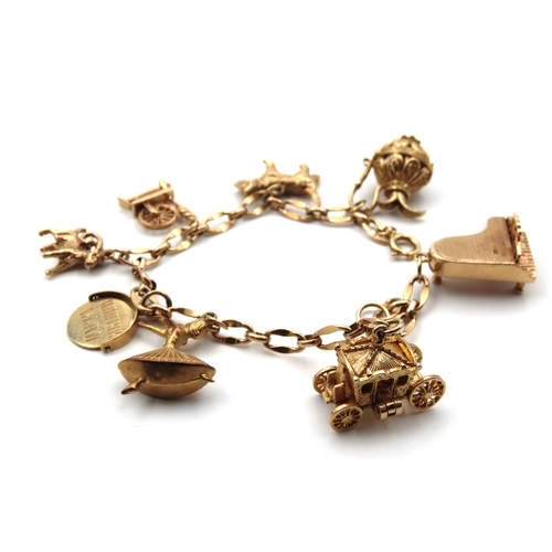 76 - 9 Carat Yellow Gold Ladies Charm Bracelet of Good Weight