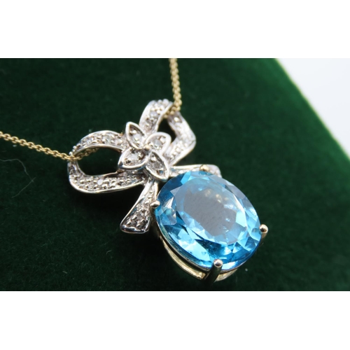 93 - 9 Carat Gold Set Blue Topaz and Diamond Ribbon Motif Pendant Necklace Mounted on 9 Carat Yellow Gold... 