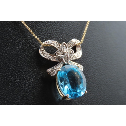 93 - 9 Carat Gold Set Blue Topaz and Diamond Ribbon Motif Pendant Necklace Mounted on 9 Carat Yellow Gold... 