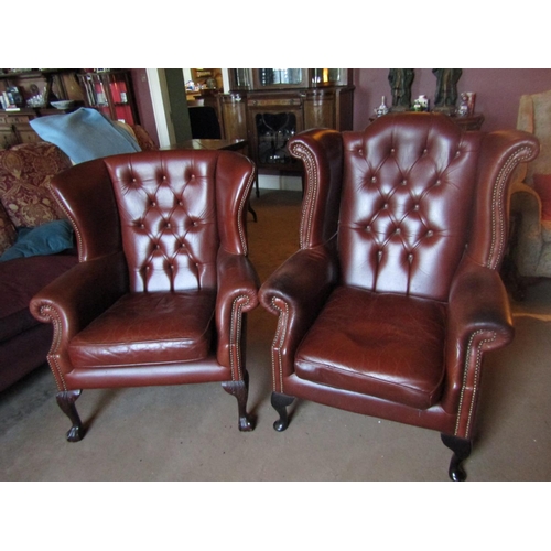 43 - Two Tan Leather Deep Button Upholstered Wingback Armchairs Well Carved Supports