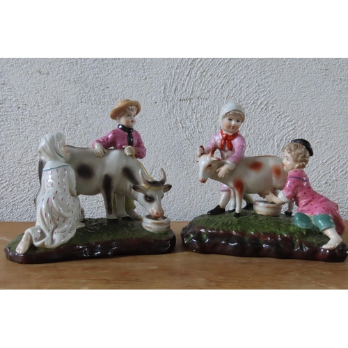 102 - Pair of Continental Porcelain Figures of Children with Goats and Cow Each Approximately 7 Inches Wid... 