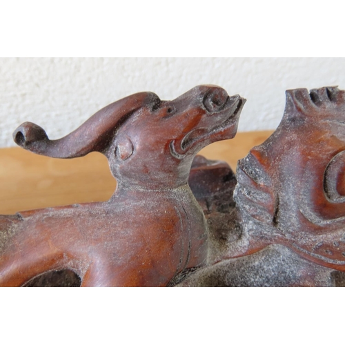 165 - Carved Hardwood Scroll Rest with Mythical Beast Carved Decoration Approximately 14 Inches Wide