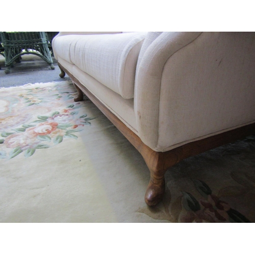 91 - Cream Fabric Upholstered Settee Roll Arm Ends above Carved Supports Approximately 7ft Wide