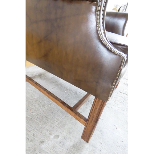 96 - Tan Leather Chesterfield Wingback Armchair Mahogany Chamfered Supports H Cross Stretcher Below Gener... 