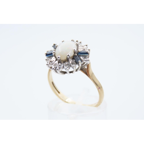 123 - Opal Cluster Ring Mounted on 9 Carat Gold Band Central Cabochon Cut Opal Flanked with Baguette Cut B... 