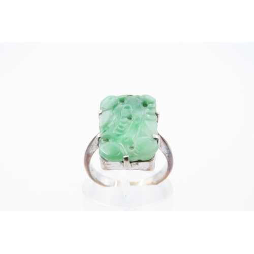 64 - Carved Jade Panel Set Jade Ring Mounted on 9 Carat White Gold Band Ring Size K