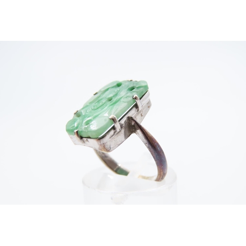 64 - Carved Jade Panel Set Jade Ring Mounted on 9 Carat White Gold Band Ring Size K