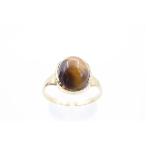 11 - Tigers Eye Solitaire Ladies Ring Mounted on 9 Carat Yellow Gold Band Ring Size V