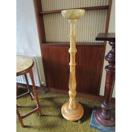 100 - Carved and Turned Torchere with Brass Paw Supports Approximately 50 Inches High