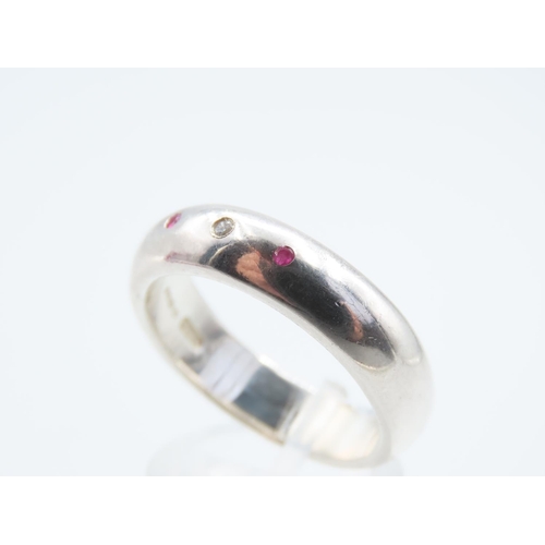 1309 - Polished Silver Ruby and Diamond Inset Ring Modernist Form Band Size V