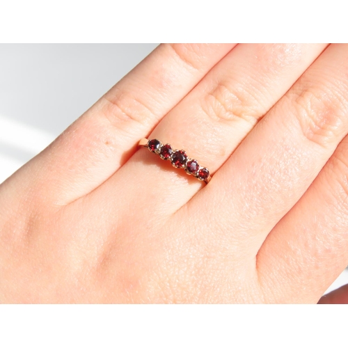 1317 - Five Stone Garnet Ring Mounted on 9 Carat Yellow Gold Band Ring Size P