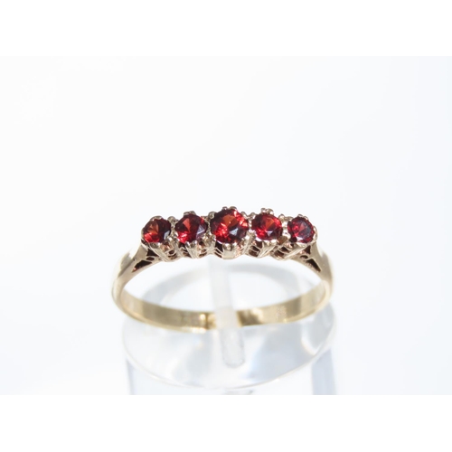 1317 - Five Stone Garnet Ring Mounted on 9 Carat Yellow Gold Band Ring Size P