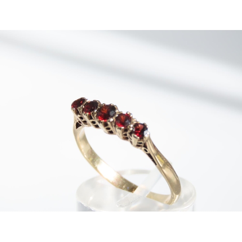 1317 - Five Stone Garnet Ring Mounted on 9 Carat Yellow Gold Band Ring Size P