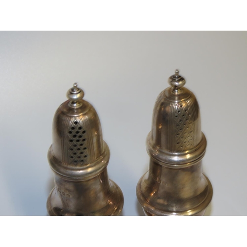 708 - Pair of Silver Pedestal Form Salt and Peppers