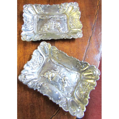 733 - Pair of Silver Rectangular Form Cherub Motif Decorated Table Dishes Attractively Detailed