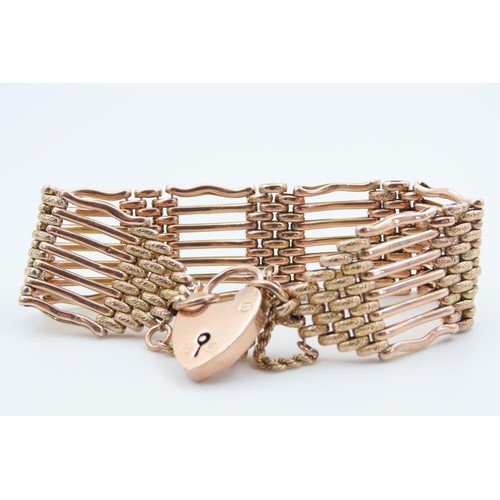 1290 - 9 Carat Rose Gold Seven Bar Ladies Bracelet Attractively Detailed with Padlock Motif Clasp and Safet... 