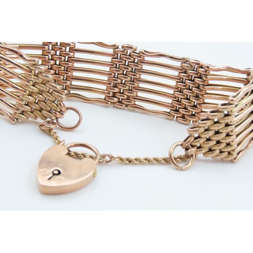 1290 - 9 Carat Rose Gold Seven Bar Ladies Bracelet Attractively Detailed with Padlock Motif Clasp and Safet... 