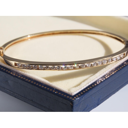 105 - Diamond Inset 14 Carat Yellow Gold Bangle Attractively Detailed Good Scintillation