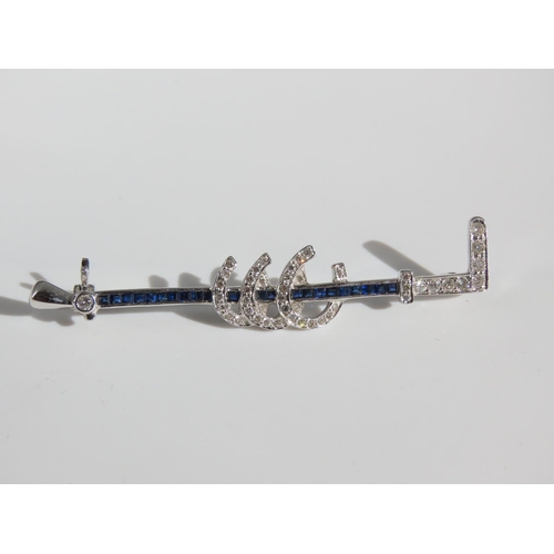 106 - 18 Carat White Gold Sapphire and Diamond Hunting Crop Motif Decorated Ladies Brooch with Further Thr... 