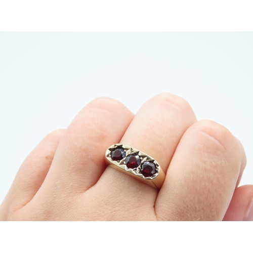17 - Three Stone Garnet Set Ladies Ring Mounted on 9 Carat Yellow Gold Band Ring Size S and a Half