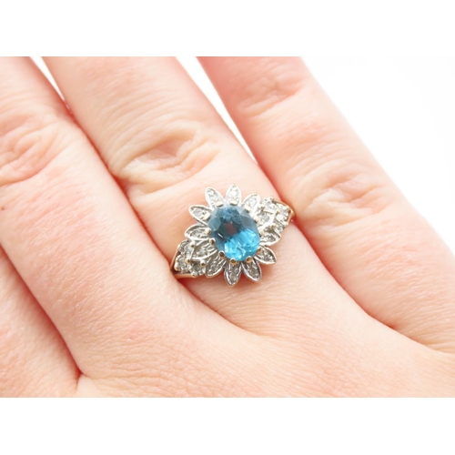 214 - Blue Topaz and Diamond Ladies Cluster Ring Mounted on 9 Carat Yellow Gold Band Ring Size Q