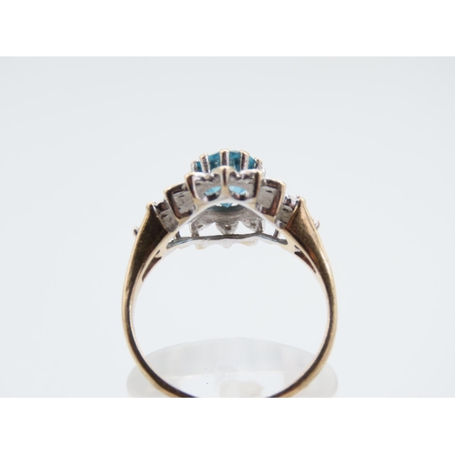 214 - Blue Topaz and Diamond Ladies Cluster Ring Mounted on 9 Carat Yellow Gold Band Ring Size Q