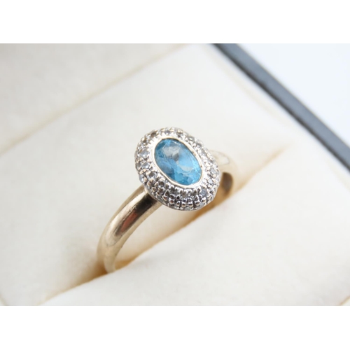 216 - Blue Topaz and Diamond Set Ladies Cluster Ring Mounted on 9 Carat Yellow Gold Band Ring Size L