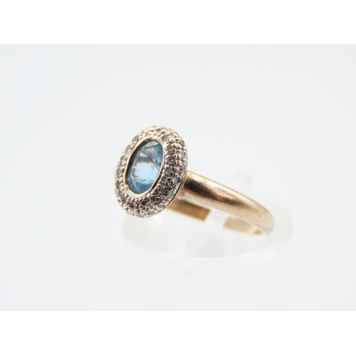 216 - Blue Topaz and Diamond Set Ladies Cluster Ring Mounted on 9 Carat Yellow Gold Band Ring Size L