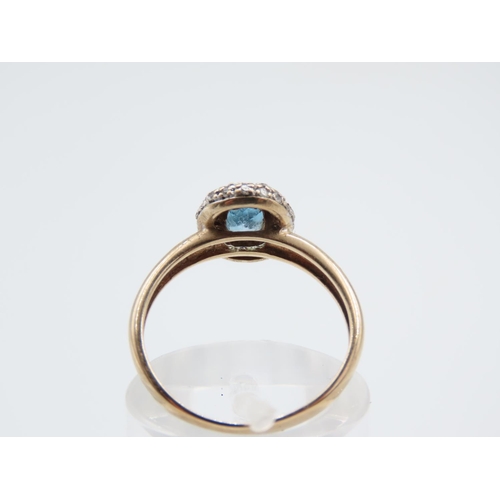 216 - Blue Topaz and Diamond Set Ladies Cluster Ring Mounted on 9 Carat Yellow Gold Band Ring Size L