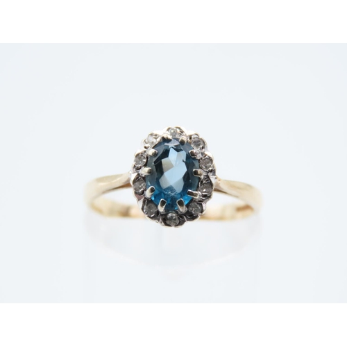 221 - Blue Topaz and Diamond Ladies Cluster Ring Mounted on 9 Carat Yellow Gold Band Ring Size N