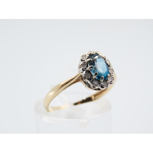 221 - Blue Topaz and Diamond Ladies Cluster Ring Mounted on 9 Carat Yellow Gold Band Ring Size N