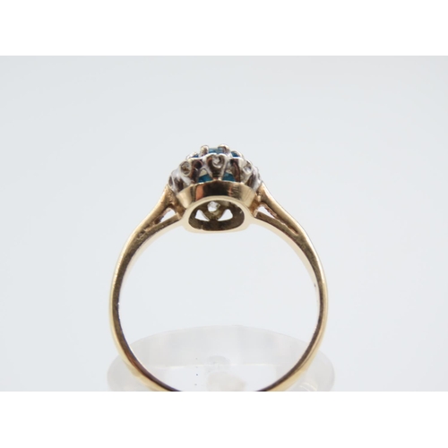 221 - Blue Topaz and Diamond Ladies Cluster Ring Mounted on 9 Carat Yellow Gold Band Ring Size N